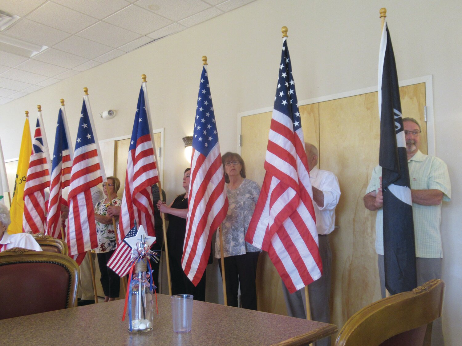 HISTORIC HAPPENING: Eight members of the Tri-city Elks carried these flags into the JSC’s all-purpose room during the Flag Day ceremony.